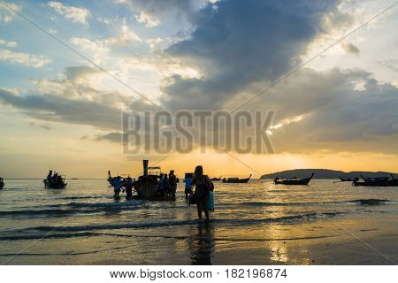 Ao Nang Krabi Thailand - March 02 2017: People on the Ao Nang beach at sunset in Krabi province Thailand