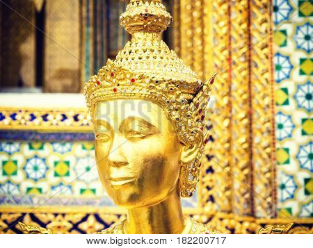 Kinnari statue at Wat Phra Kaew in Grand Palace, Bangkok Thailand.