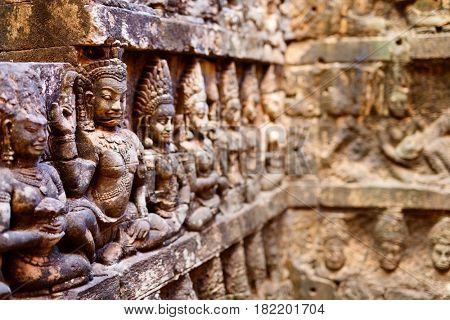 Bas reliefs in Terrace of the Leper King in Angkor Archaeological area in Cambodia