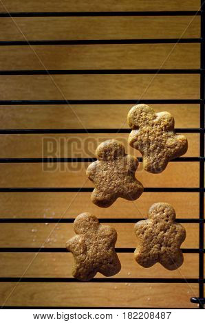 Baked Gingerbread men cookies on cooling rack