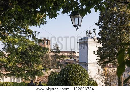 Statues with clock on Loggia di San Giovanni in Udine Italy