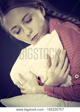 Sad Depressed Girl In Bed Gripping Pillow