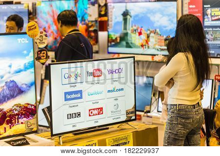BANGKOKTHAILAND-December 252016: Buyer consider to buy Smart TV in consumer market price drop and popular in Southeast Asia super market