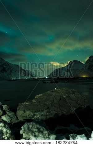 Aurora Borealis Known as Nother Lights Playing with Vivid Colors Over Lofoten Islands in Norway. Horizontal Image Orientation