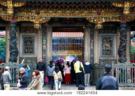Taipei Taiwan - January 21 2017 - Lungshan Temple of Manka packed with worshippers and tourists
