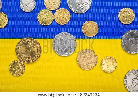 Ukrainian national coins against the background of the national flag. Eurovision currency