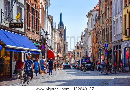Bruges Belgium-June 10 2016: The street view with shops and restaurants along the both sides in the old town of Bruges places for tourists to hang out.