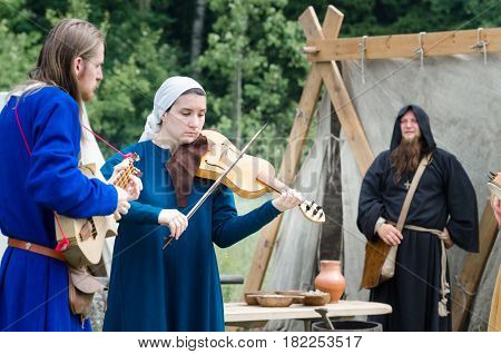RITTER WEG MOROZOVO APRIL 2017: Medieval musicians outdoor play music instruments medieval festival