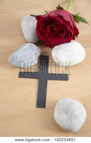 funeral card - a black ribbon and stones