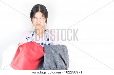 Housewife is tried and angry with a lot of clothes for laudry