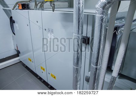 Gray air handling unit in the ventilation plant room