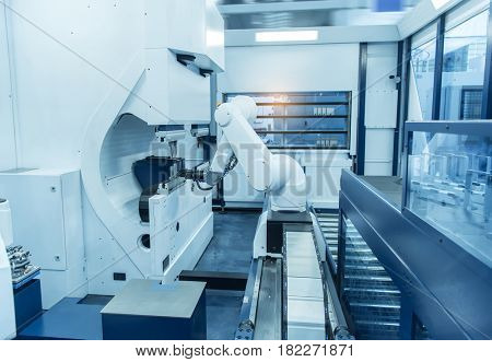 robotic arm machine tool at industrial manufacture plant,Smart factory industry 4.0 concept.