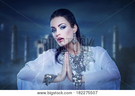 Beautiful princess belly dancing in orient night
