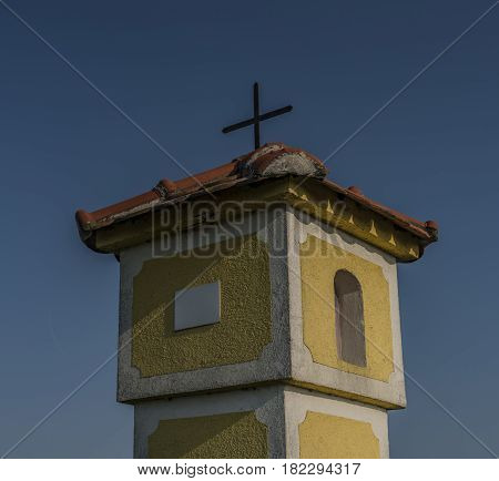 Yellow chapel near Strachotin village in spring sunny evening