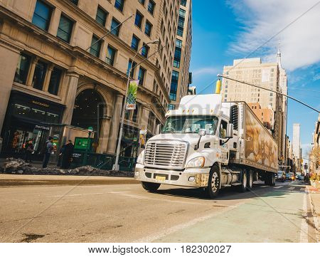New York Usa - March 20 2017 : Dunkin' Donuts truck is crossing street at downtown manhattan.