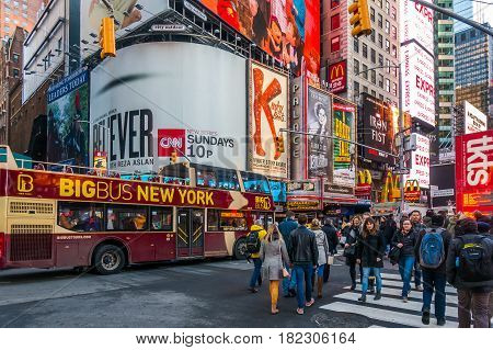 New York City USA- March 17 2017: Times Square featured with Broadway Theaters and animated colorful LED signs stores and lots of tourists and locals is a symbol of NYC and the USA in Manhattan.