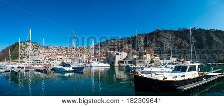 View of vacation house in marina Porto piccolo Sistiana Italy with sailing boats