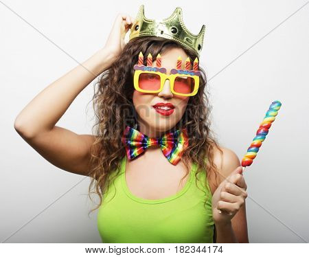 Young woman having fun. Young pretty woman with crown is laughin
