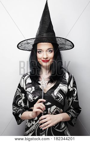 Funny Witch. Young happy woman with canival hat.
