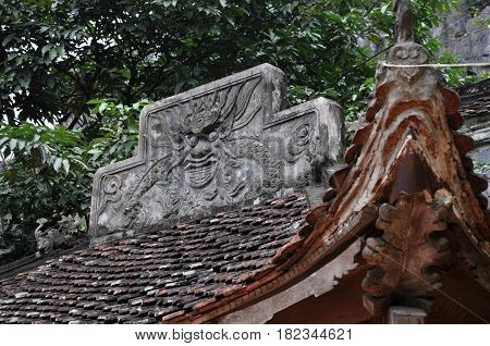 Antique Carving In Stone With Mythical Motif. Bich Dong Pagoda, Vietnam