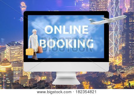 Laptop Showing Online Booking On Screen With Commercial Airplane Flying Over Big City In Background.
