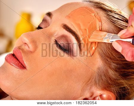 Collagen face mask . Facial skin treatment. Face of woman receiving cosmetic procedure in beauty salon close up isolated.