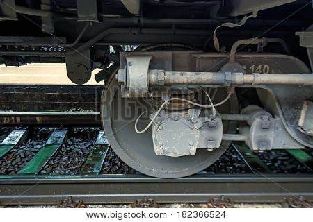 Side view on wheels of the railway car undercarriage
