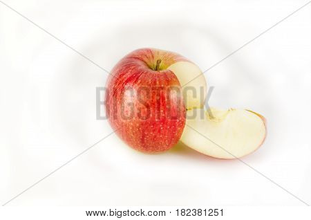 Red apple and slice isolated on white background