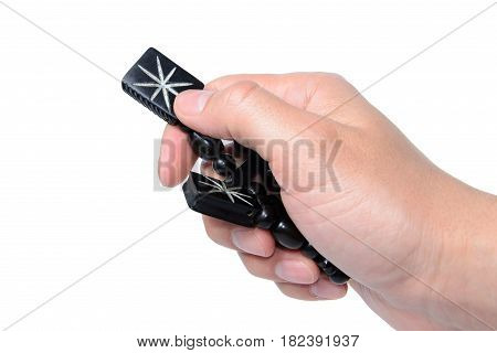 Rosary in hand on a white background isolated.
