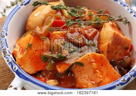 Bowl with delicious chicken cacciatore, closeup