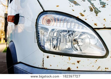 Big Headlight of an old rusty car