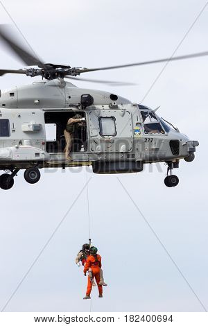 GILZE RIJEN NETHERLANDS - JUNE 21 2014: Rescue operation by a Royal Netherlands Navy NH90 helicopter.