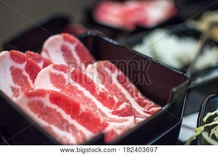 Pork Raw Meat Slides On Dish At Bbq. Restaurant
