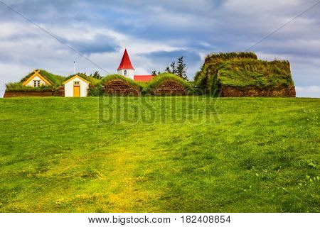 Farm Museum in Glaumbaer. The picturesque village of old houses covered with turf and grass. The concept of the ethnographic and cultural tourism
