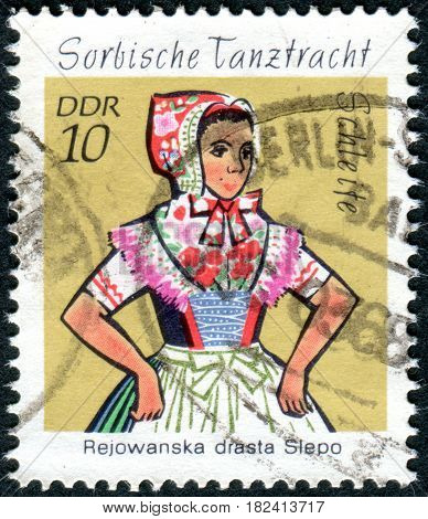 GERMANY - CIRCA 1971: A stamp printed in Germany (GDR) shows the Sorbian Dance Costumes from Schleife circa 1971