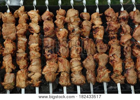 Meat is grilled / Schaschlik / Barbecue cooking