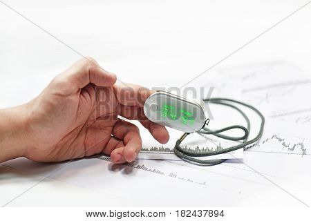 Blood Oxygen Meter On Mans Finger.