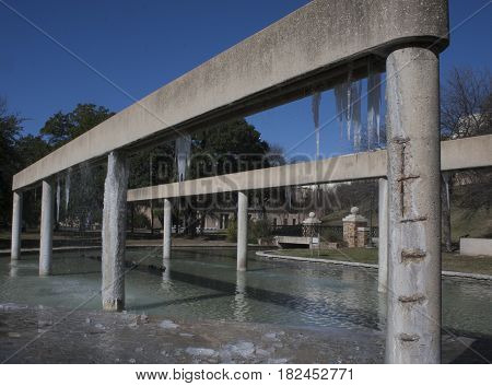 Frozen water features with icicles in San Antonio