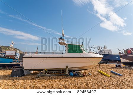 View Of The Seaside Town, Fishing Boats On The Shore, Stony Beach, Hill