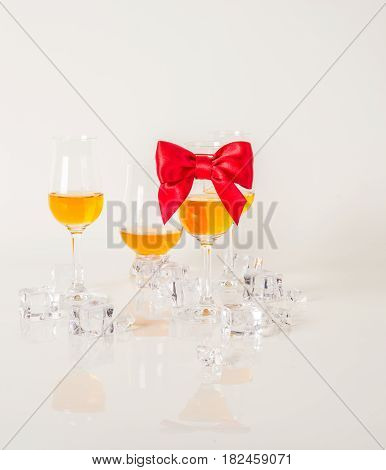 Set Of Single Malt Tasting Glasses, Single Malt Whisky In A Glasses, White Background, Red Bow