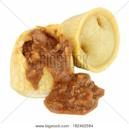 Two steamed steak and kidney puddings isolated on a white background