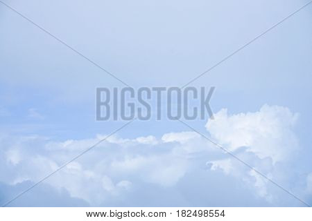 light blue sky with puffy clouds in the morning