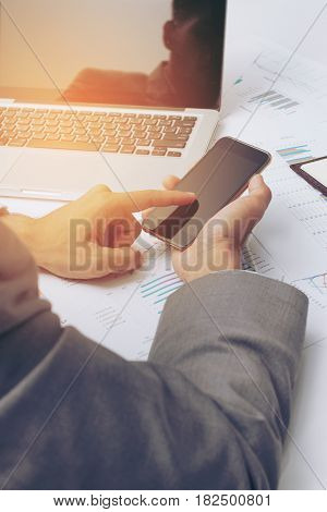 Young Businessman Working At Office, Writes Marketing Plans And On The Notepad Strategy Diagram As C