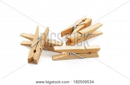 Wooden clothespin composition isolated over the white background