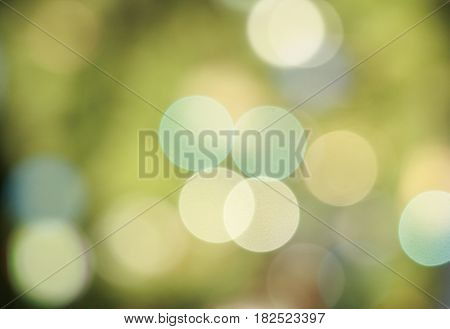 green background with lights in the distance, bokeh