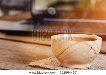 Coffee Cup And Notebook On Wood Table