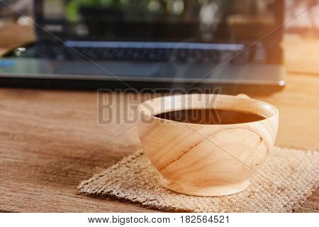 Coffee Cup And Notebook On Wood Table