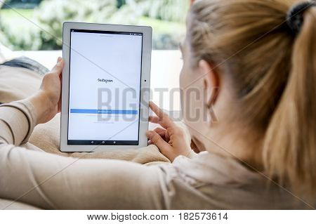 Wroclaw, Poland- April 10Th, 2017:  Woman Launches Instagram Application On Lenovo Tablet. Instagram