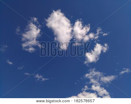 White clouds shape with blue sky. Pillows like white cloud. Springr weather with cloudy sky. Abstract texture