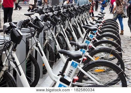 MADRID SPAIN - OCT 10 2014: Bikes parked on the sidewalk belonging to Madrid public system (BiciMad) in Madrid.